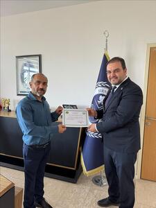 ilahiyat-fakultesi-dekanligindan-genel-sekreterimiz-doc-dr-mustafa-cabir-altintasa-uluslararasi-b